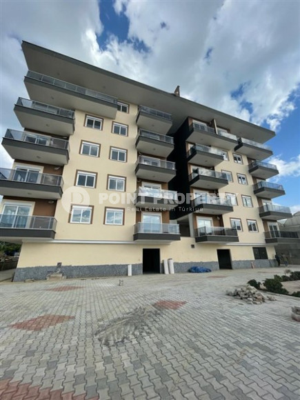 One-bedroom apartment, 65m², in a new complex 1100m from the sea in Kargicak, Alanya-id-2725-photo-1