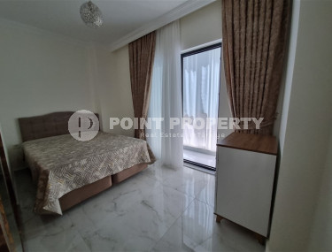 Stylish, two-room apartment with 1+1 layout, 75m2 in Alanya, in the popular Mahmutlar area.-id-1250-photo-1