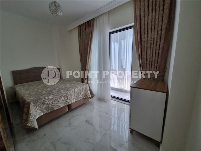 Stylish, two-room apartment with 1+1 layout, 75m2 in Alanya, in the popular Mahmutlar area.-id-1250-photo-1