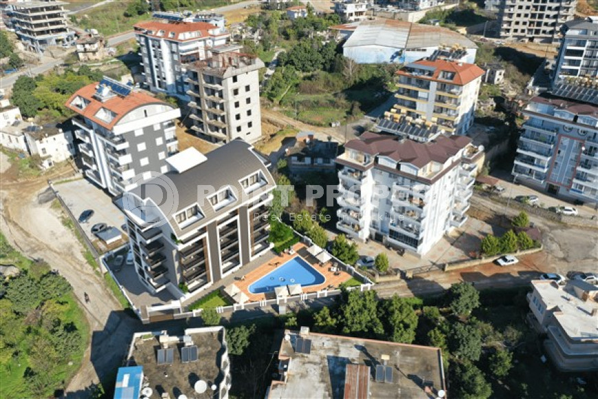 New 1+1 apartment in a building under construction, Upper Oba, Alanya-id-2925-photo-1
