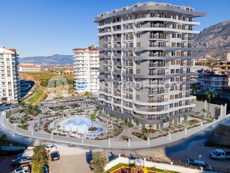 New 1+1 apartment on the 10th floor of a complex with a large area, Mahmutlar, Alanya-id-3102-photo-1