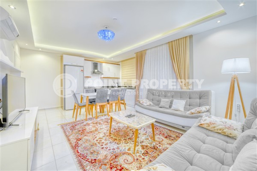 Lovely 2+1 apartment in white and gold tones, on the second line from the sea, Mahmutlar, Alanya-id-3145-photo-1