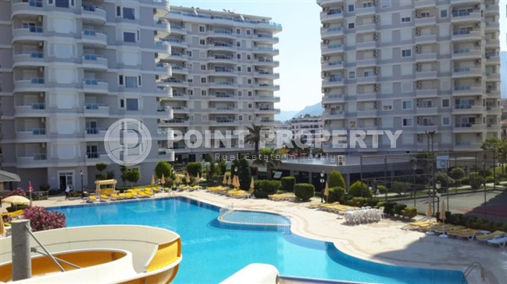 Apartment with an area of 120 m2 in the Tosmur area, Alanya, with a convenient location on the first sea line-id-3212-photo-1