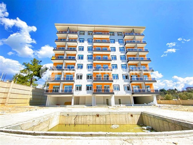 Новые апартаменты 1+1 стандартной площади 60 м² в жилом комплексе Авсаллара, Аланья-id-3396-фото-1