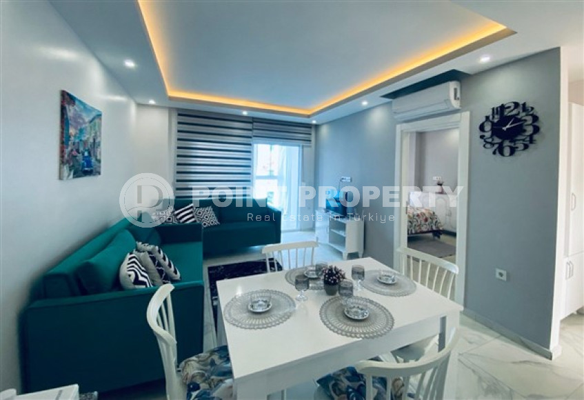 Inexpensive 1+1 apartment with an area of 65 m2 just 350 meters from the sea, Mahmutlar district-id-3495-photo-1