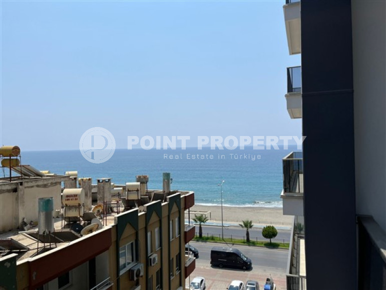 Small two-level apartment 50 m2 on the first line of the sea, Mahmutlar district-id-3520-photo-1