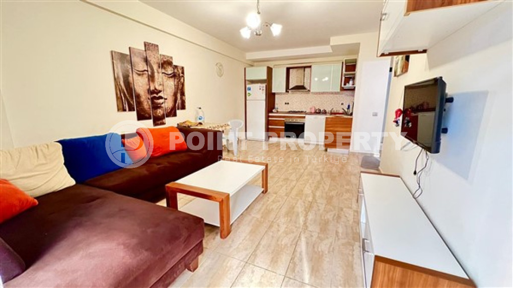 Compact, bright 1+1 apartment 300 meters from the center of Mahmutlar.-id-3640-photo-1