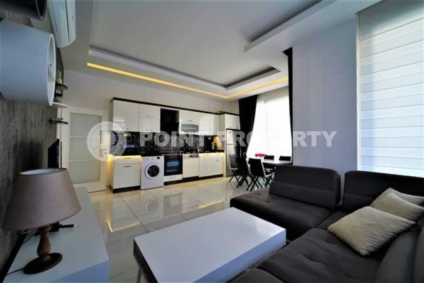 Three-room apartment with an area of 100 m2, Alanya center. Sold furnished.-id-3650-photo-1