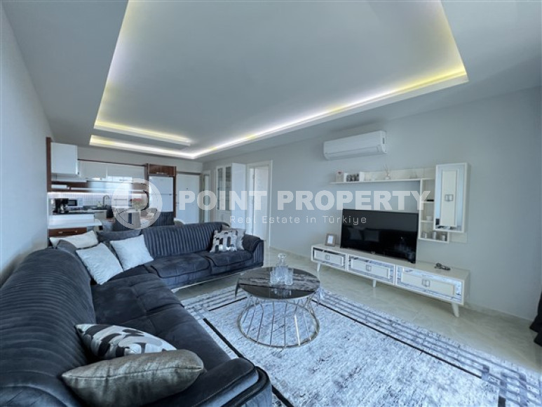 Furnished two-room apartment 80 m2 in a high-rise residence, Mahmutlar district-id-3693-photo-1