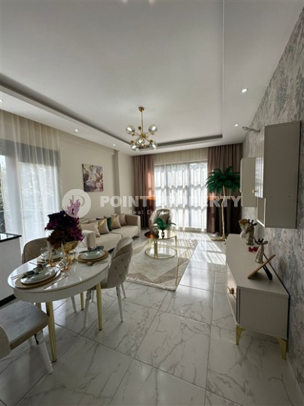 Apartment in a new building built in 2022 in the prestigious Oba area of Alanya.-id-3733-photo-1
