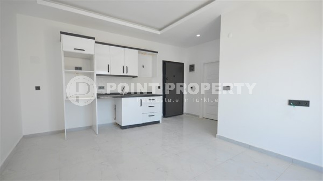 New 1+1 apartment in a beautiful, quiet area of Kargicak.-id-3782-photo-1