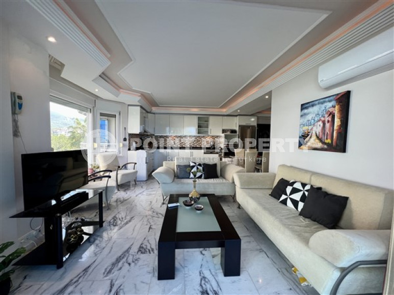 Three-room apartment with modern design on the seashore in the Tosmur area.-id-3820-photo-1
