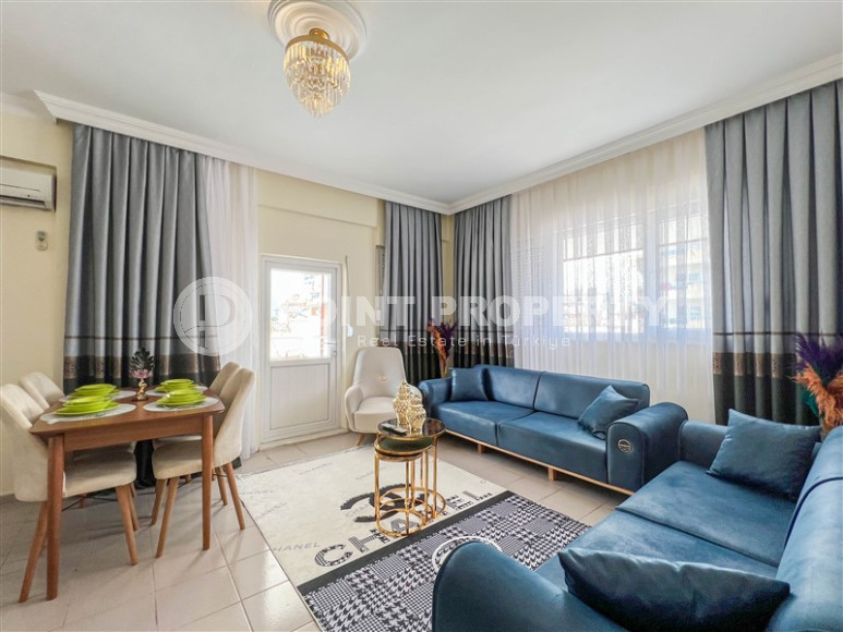 Cozy one-bedroom apartment in the sought-after area of Mahmutlar, just 50 meters from the sea.-id-1325-photo-1