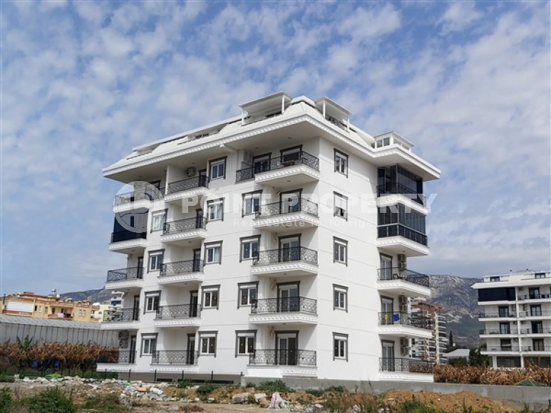 Недорогие двухкомнатные апартаменты 50 м2 в недавно построенном комплексе в 500 метрах от моря, Каргыджак-id-3895-фото-1