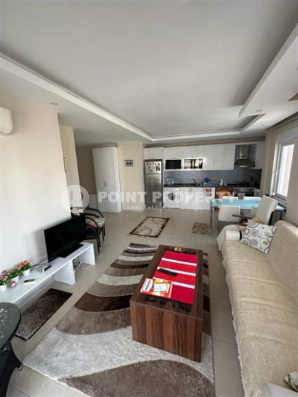 Small furnished one-bedroom apartment 500 meters from the sea in the center of Mahmutlar.-id-3899-photo-1