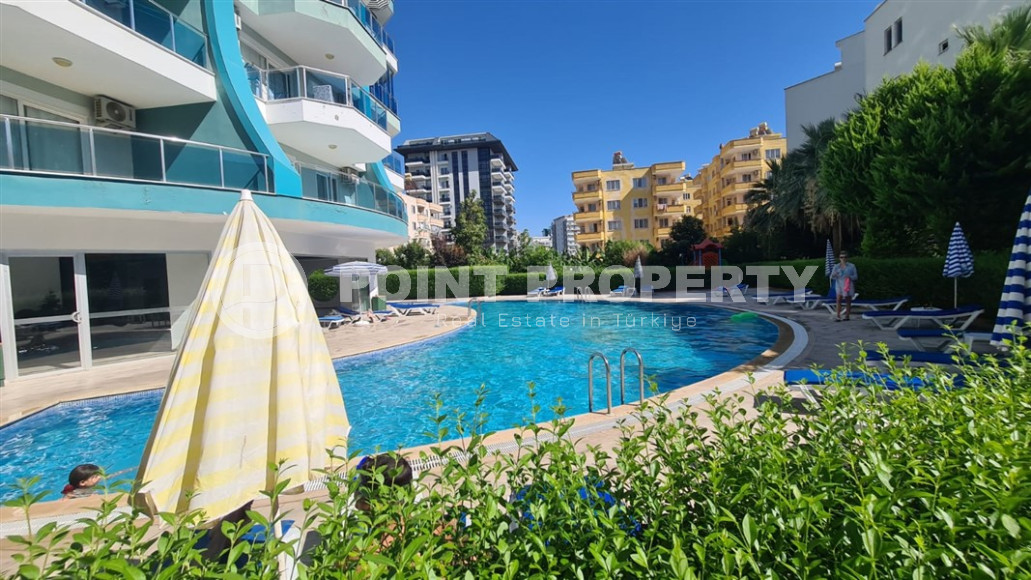 Cozy two-room apartment with a 1+1 layout and an area of 75 m2 in a complex with a swimming pool in the Mahmutlar area, 400 meters from the sea-id-1329-photo-1
