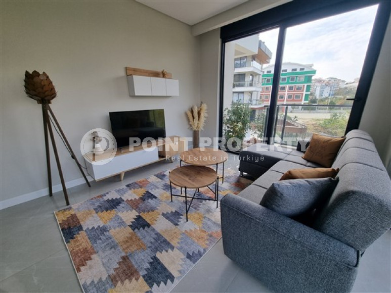 Beautiful studio apartment with modern design in the popular Oba area of Alanya.-id-3988-photo-1