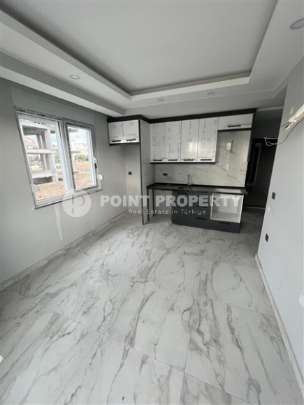 Новая квартира 1+1 с чистовой отделкой в перспективном спокойном районе Аланьи Газипаша.-id-4059-фото-1