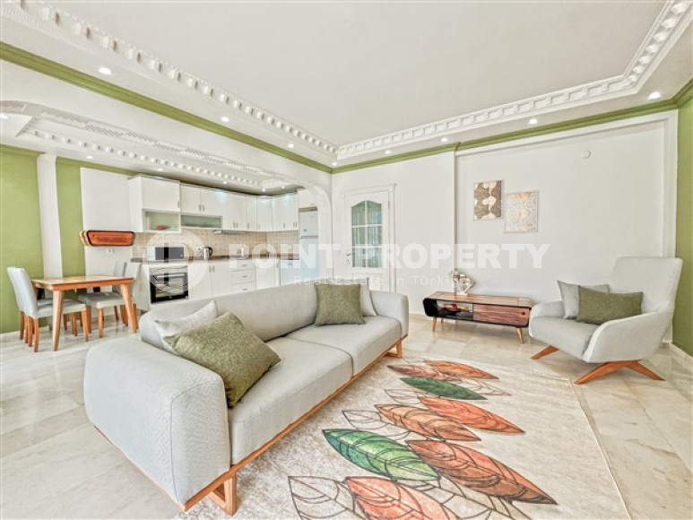 Beautiful bright 2+1 apartment with furniture and household appliances in the center of Mahmutlar.-id-4175-photo-1