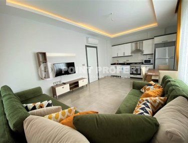 Классическая двухкомнатная квартира с мебелью в районе Махмутлар. Жилая площадь 56 м2.-id-4316-фото-1