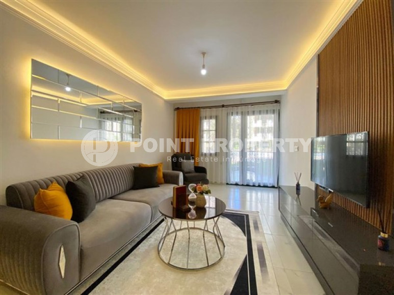 Ready-to-move-in apartment of 50 m2 with access to the Mediterranean Sea, Mahmutlar district.-id-4319-photo-1