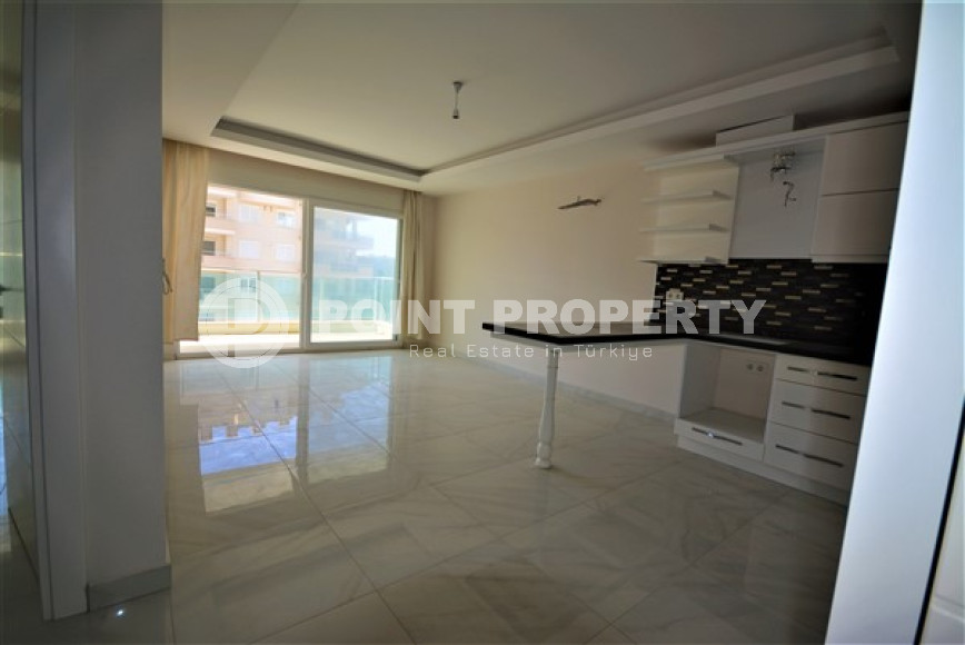 Spacious 1+1 apartments with fine finishing in the center of Mahmutlar and 200 meters from the sea.-id-4344-photo-1