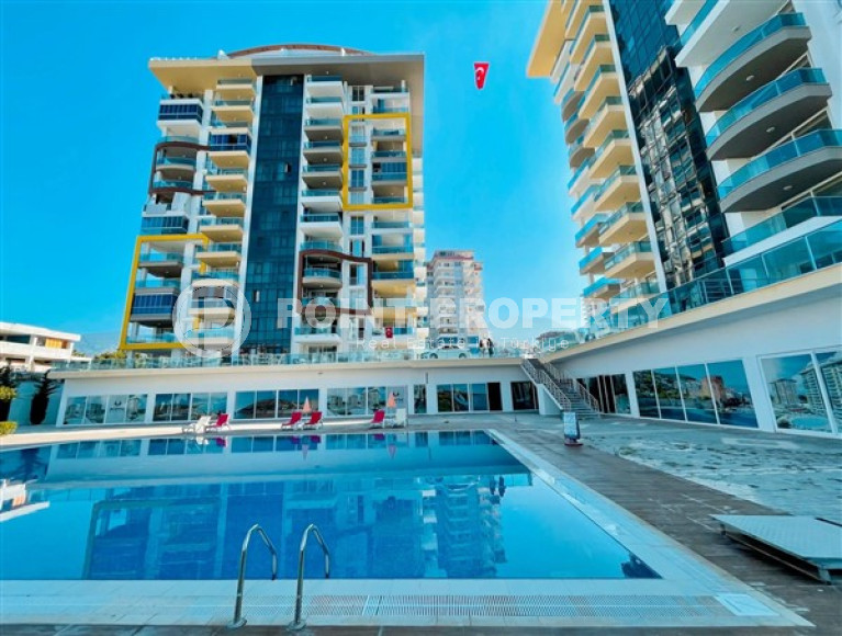 Inexpensive two-room apartment on the 3rd floor of the complex in 2021, Mahmutlar district-id-4435-photo-1
