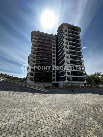 Apartment with an area of 51 m2 on the 7th floor of a high-rise residence, Mahmutlar district-id-4438-photo-1