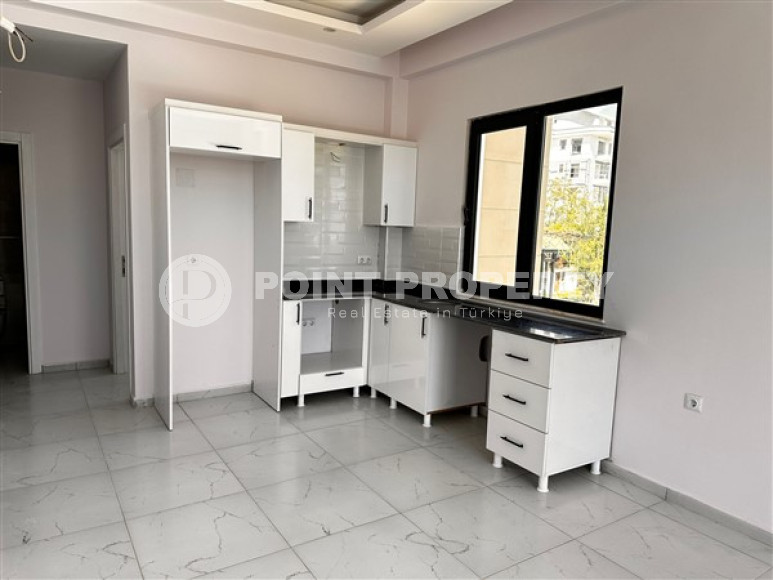 Небольшая квартира с чистовой отделкой в новом жилом комплексе в спокойном благоустроенном районе Авсаллар.-id-4453-фото-1