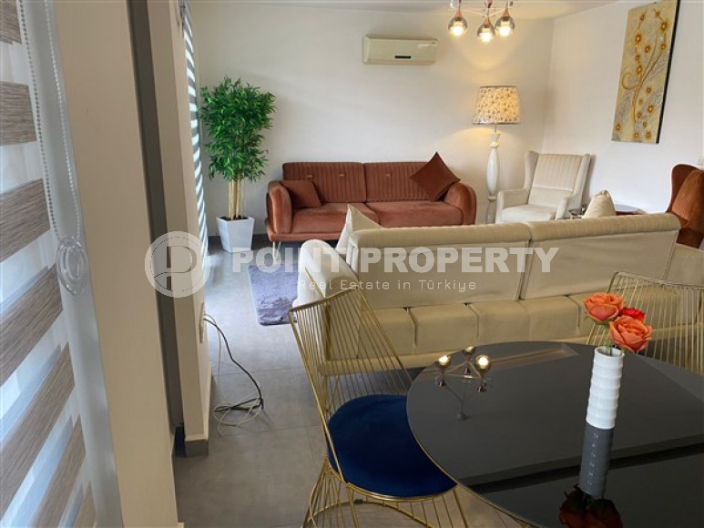 Comfortable modern 2+1 apartments with a total area of 110 m2 in the popular Oba area of Alanya.-id-4462-photo-1