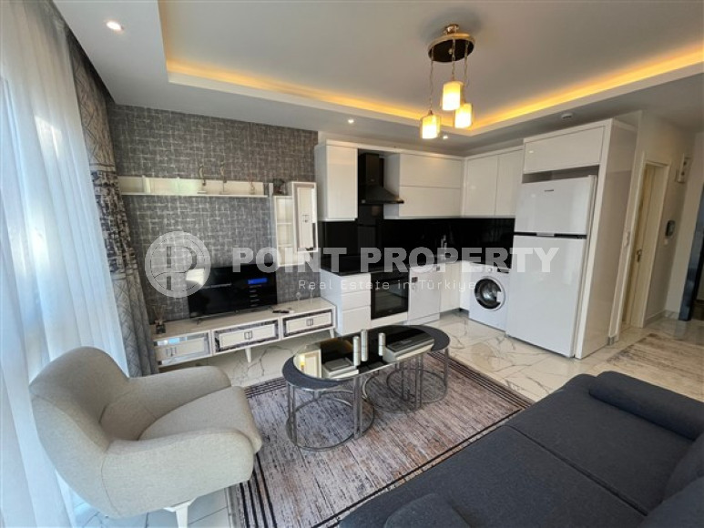 Comfortable 1+1 apartment with an area of 50 m2 250 meters from the center of Alanya-id-4525-photo-1