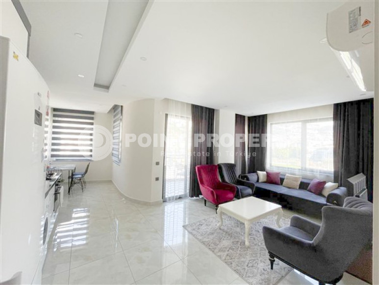 Modern 1+1 apartment on the 7th floor with luxurious panoramic views of the Taurus Mountains.-id-4577-photo-1