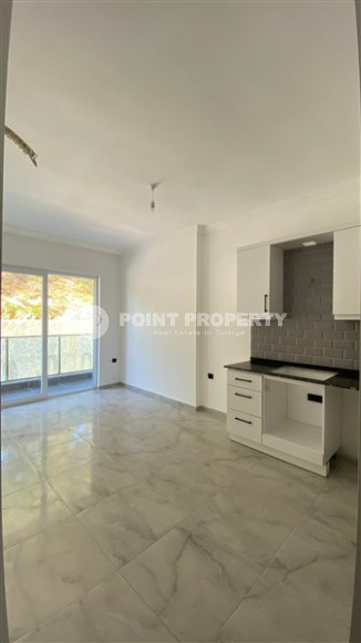 Compact 1+1 apartment on the 1st floor in a new residence, commissioned in 2023.-id-4658-photo-1