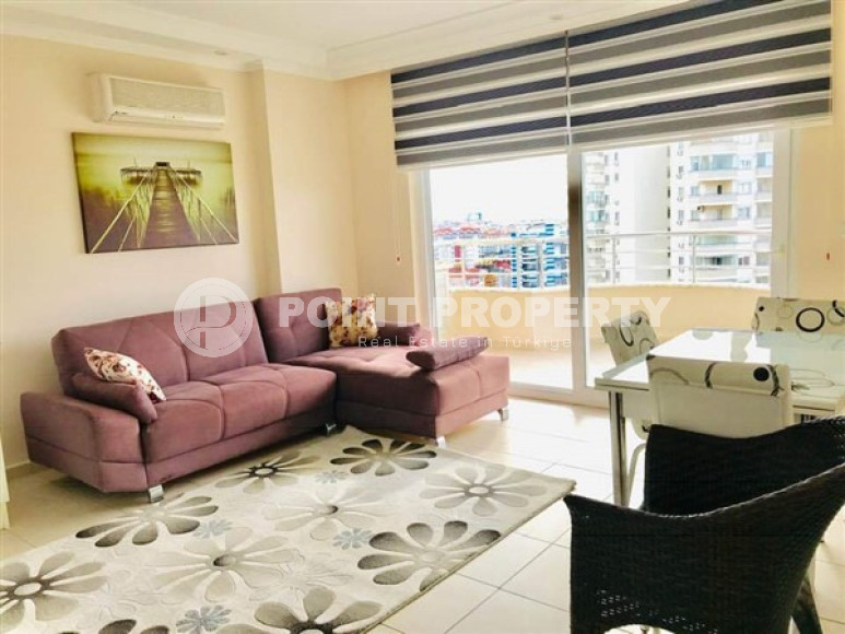 Modern, bright apartment on the 7th floor with panoramic views of the city, sea and Taurus Mountains.-id-4697-photo-1
