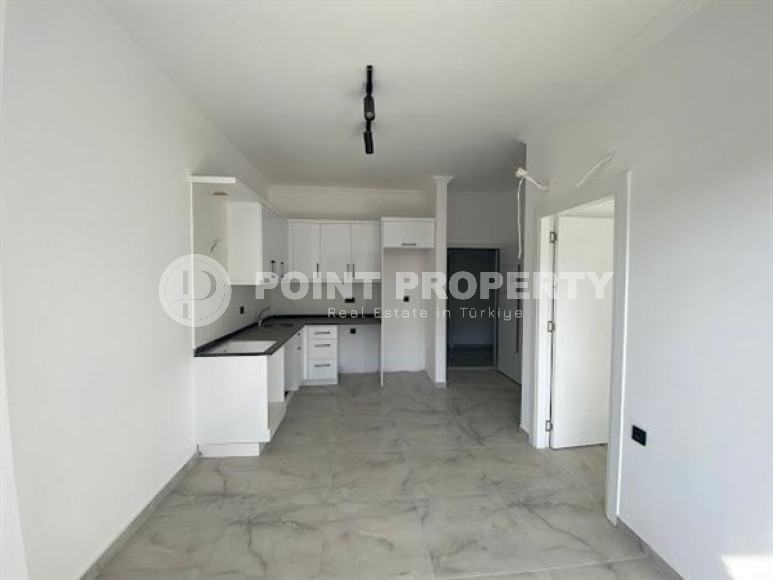 Small 1+1 apartment with fine finishing on the 3rd floor in a new residence, commissioned in 2022.-id-4724-photo-1