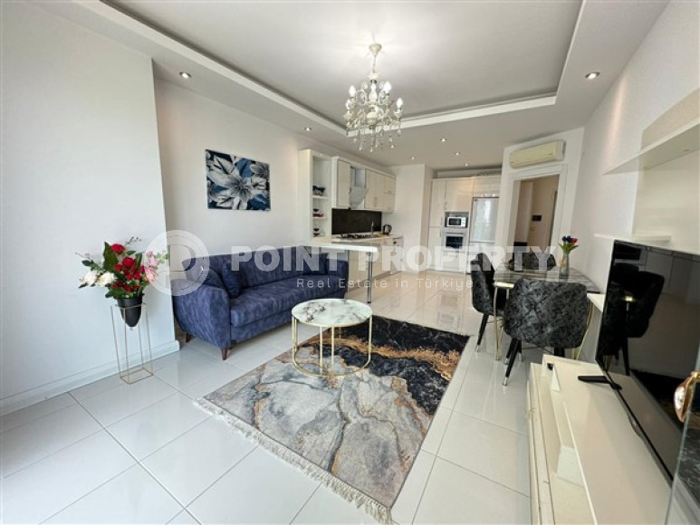 Classic 1+1 apartment with an area of 67 m2 in a high-rise complex in Mahmutlar-id-4737-photo-1