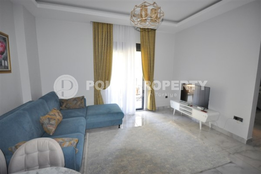 Compact apartment 1+1, total area 55 m2, 500 meters from the sea in the center of Mahmutlar-id-4768-photo-1