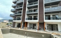 Строящиеся двухкомнатные апартаменты с площадью 63 м2, район Тосмур-id-4878-фото-9
