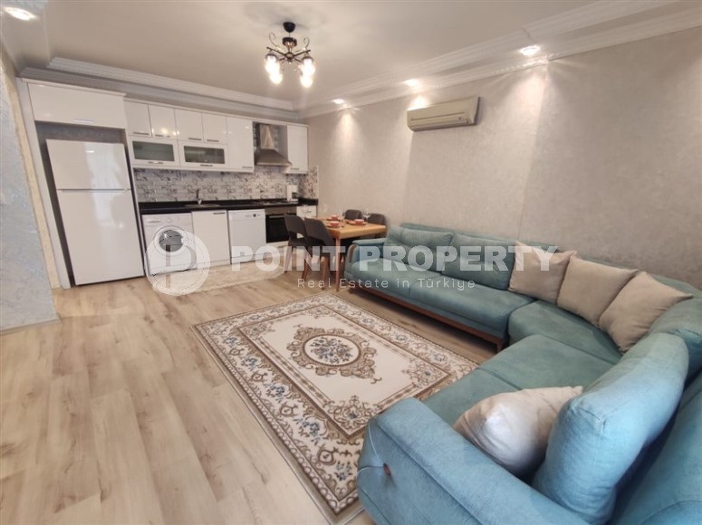 Furnished two-bedroom apartment 150 meters from the beach in the center of Alanya's popular Mahmutlar area.-id-4222-photo-1