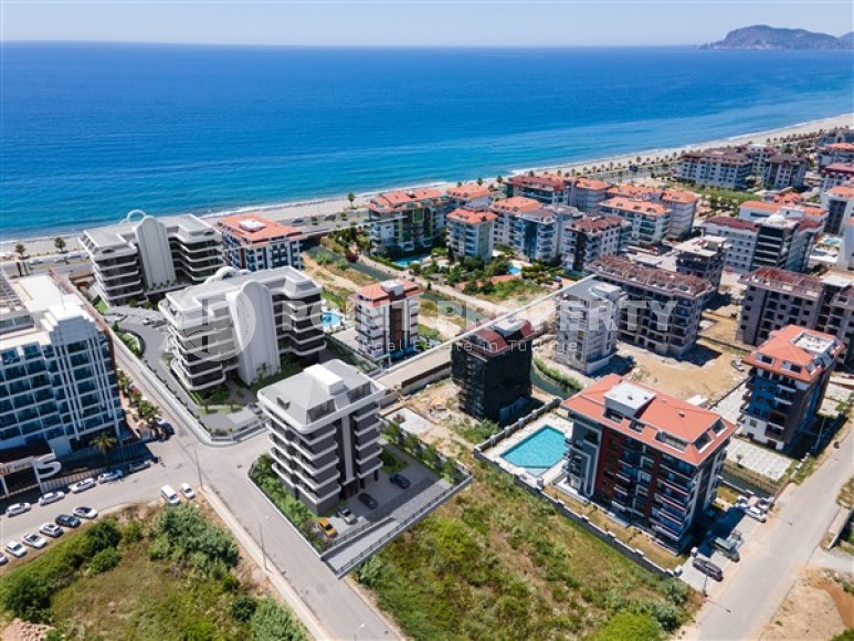 Апартаменты в новой резиденции на этапе строительства с возможностью получения рассрочки платежа и вида на жительство в Турции-id-5117-фото-1