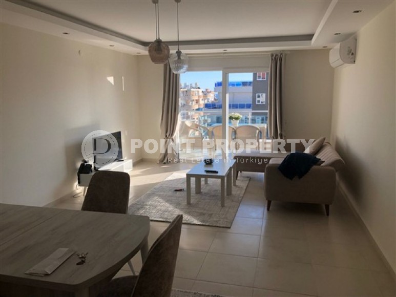 Panoramic apartment 1+1, with a total area of 70 m2, on the 11th floor in the center of Mahmutlar district-id-5422-photo-1